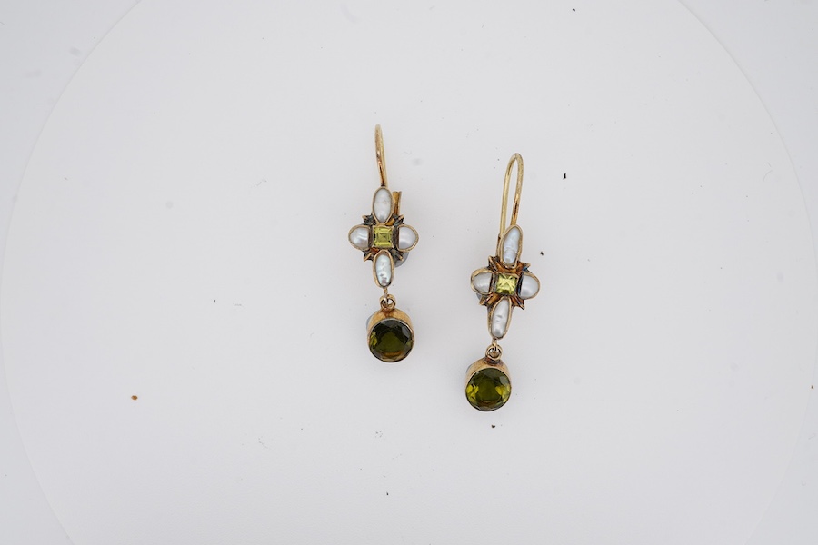 A pair of gilt white metal, peridot and baroque pearl cluster set drop earrings, 40mm. Condition - poor to fair